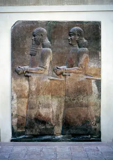 Assyrian relief of two servants, Palace of Sargon II, Khorsabad, c8th century BC