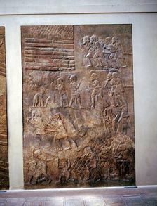 Assyrian relief showing transport of timber by land, Khorsabad, c8th century BC