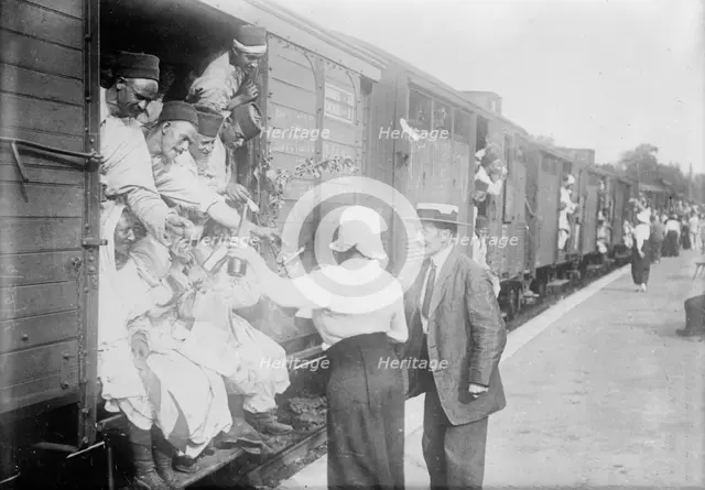 At Champigny, giving wine to Algerian troops, between c1914 and c1915. Creator: Bain News Service.