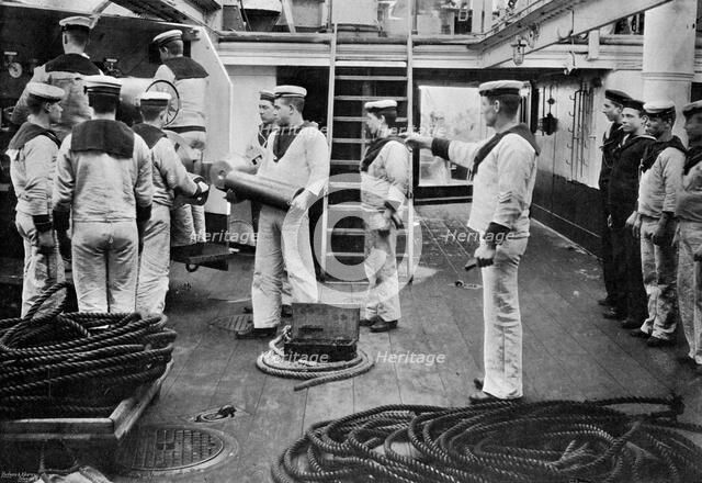 At drill with a 6 inch quick firing gun on board the battleship HMS 'Resolution', 1896.Artist: Gregory & Co