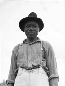 At Hill House, Mississippi - He wears the union button, 1936. Creator: Dorothea Lange