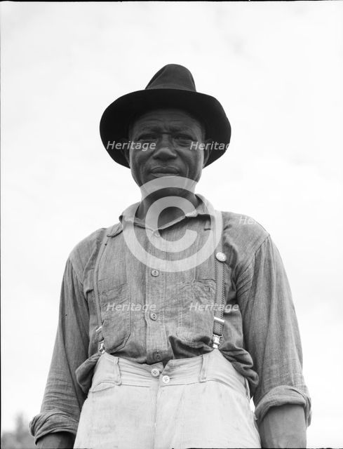 At Hill House, Mississippi - He wears the union button, 1936. Creator: Dorothea Lange.