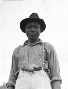 At Hill House, Mississippi - He wears the union button, 1936. Creator: Dorothea Lange