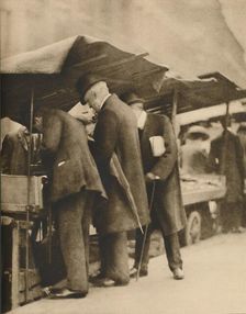 At One of the Bookstalls of the Farringdon Road Market c1935. Creator: Walter Benington