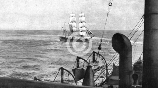 At sea; During boarding, a patrol cruiser turns on the visiting vessel which it encircles..., 1917. Creator: Unknown.