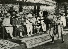 At Suva, Fiji. Presenting a "Tabua" (Tooth of the Sperm Whale) ...1927 1937. Creator: Unknown