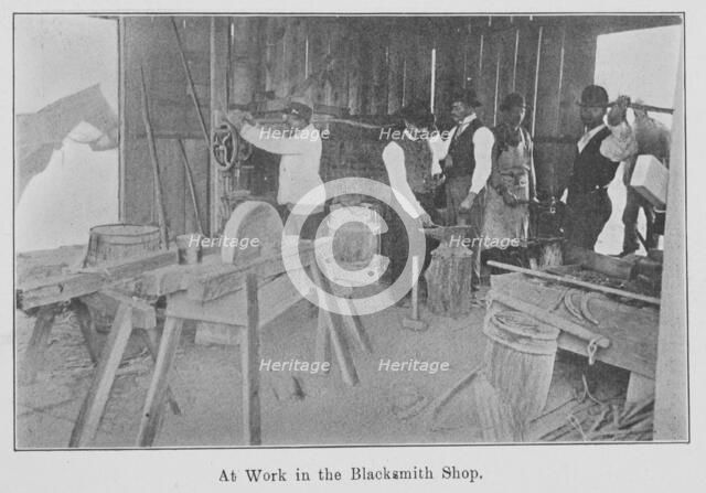 At work in the Blacksmith Shop., 1903. Creator: Unknown.