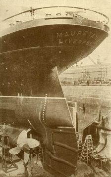 At Work on the Stern of the "Mauretania", in Dry Dock c1930. Creator: Unknown