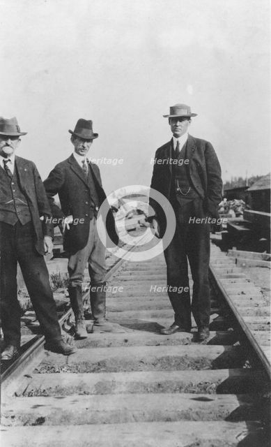 At the new railroad left to right are: Mr. Edes, Frank G. Carpenter,..., between c1900 and 1916. Creator: Unknown.
