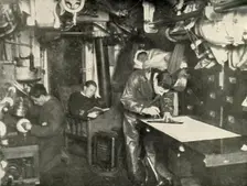 At the Bottom of the Sea. In the wardroom of a submarine (1919). Creator: Unknown