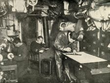 At the Bottom of the Sea. In the wardroom of a submarine (1919). Creator: Unknown