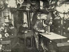 At the Bottom of the Sea. In the wardroom of a submarine (1919). Creator: Unknown
