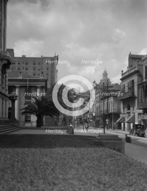 At the corner of Royal and Conti streets, New Orleans, between 1920 and 1926. Creator: Arnold Genthe.