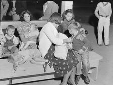 At the end of the Halloween party at Shafter migrant camp, California, 1938. Creator: Dorothea Lange