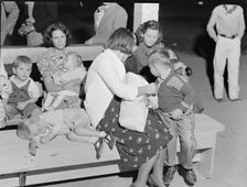At the end of the Halloween party at Shafter migrant camp, California, 1938. Creator: Dorothea Lange