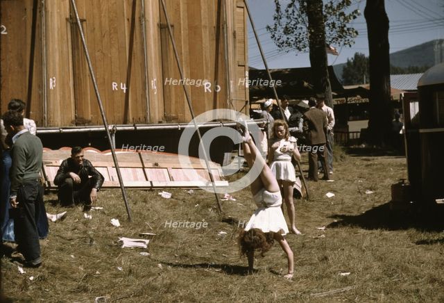 At the Vermont state fair, Rutland, "backstage" at the "girlie" show, 1941. Creator: Jack Delano.