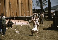 At the Vermont state fair, Rutland, "backstage" at the "girlie" show, 1941. Creator: Jack Delano