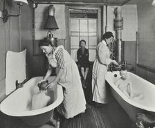 Attendants bathing boys at the Central Street Cleansing Station, London, 1914