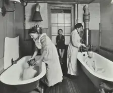 Attendants bathing boys at the Central Street Cleansing Station, London, 1914