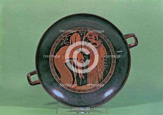 Attic Cup with the representation of Athena and the Dragon of Colchis throwing the body of Jason.
