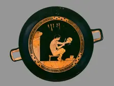 Attic red-figure cup depiting a seated helmet maker and his equipment, c480 BC. Artist: Antiphon Painter