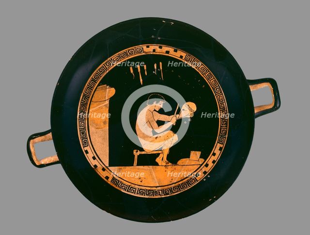 Attic red-figure cup depiting a seated helmet maker and his equipment, c480 BC. Artist: Antiphon Painter.