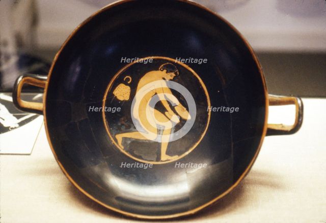 Athlete with Jumping-Weight, detail of Greek Kylix, (drinking-cup), c6th century BC.