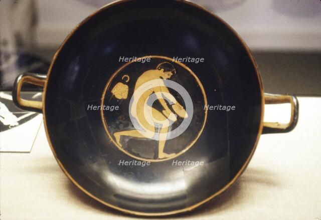 Athlete with Jumping-Weight, detail of Greek Kylix, (drinking-cup), c6th century BC.
