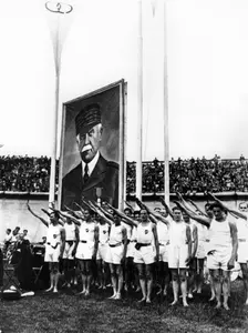 Athletes giving the fascist salute, Parc des Princes, Paris, 1941