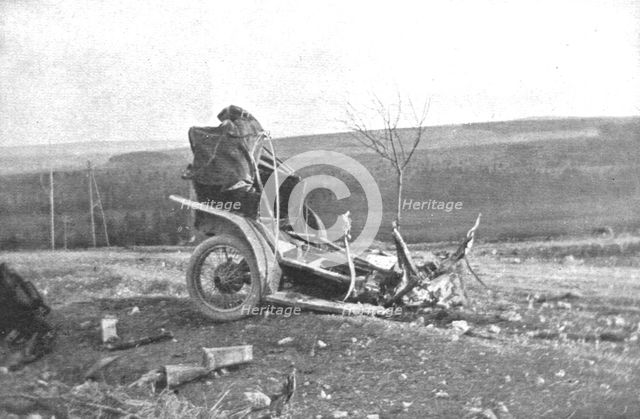 'Au Volant; Automobile de liaison fracassee lar un projectile, le mars 1916, a l'Ouest de..., 1916. Creator: Unknown.