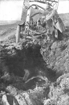 Au Volant; Camion demoli, pres de Verdun, par un obus de 210: le radiateur detache est..., 1916. Creator: Unknown