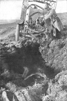 Au Volant; Camion demoli, pres de Verdun, par un obus de 210: le radiateur detache est..., 1916. Creator: Unknown