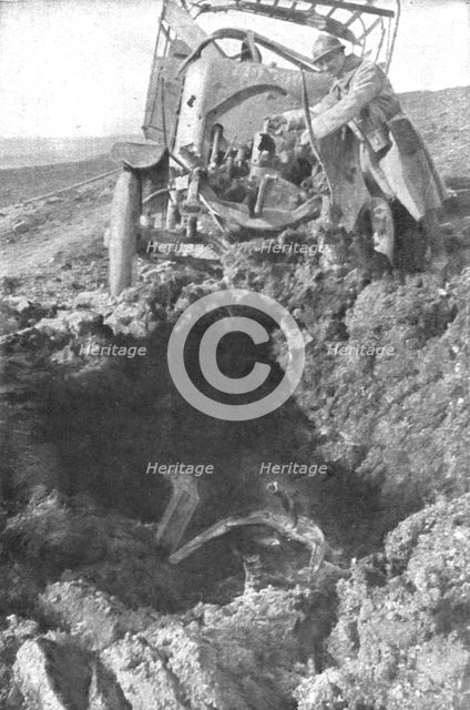 'Au Volant; Camion demoli, pres de Verdun, par un obus de 210: le radiateur detache est..., 1916. Creator: Unknown.