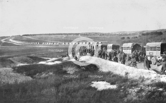 'Au Volant; Sur une route strategique, a proximite de la ligne de feu: releve de troupes par...,1918 Creator: Unknown.
