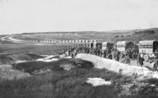 Au Volant; Sur une route strategique, a proximite de la ligne de feu: releve de troupes par...,1918 Creator: Unknown