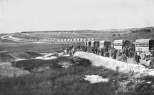 Au Volant; Sur une route strategique, a proximite de la ligne de feu: releve de troupes par...,1918 Creator: Unknown