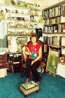 Author Sarah Fabian Baddiel at home with some of her collection of golf memorabilia