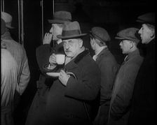 Author Sir James Barrie Drinking a Cup of Tea Surrounded By Male Civilians, 1924. Creator: British Pathe Ltd