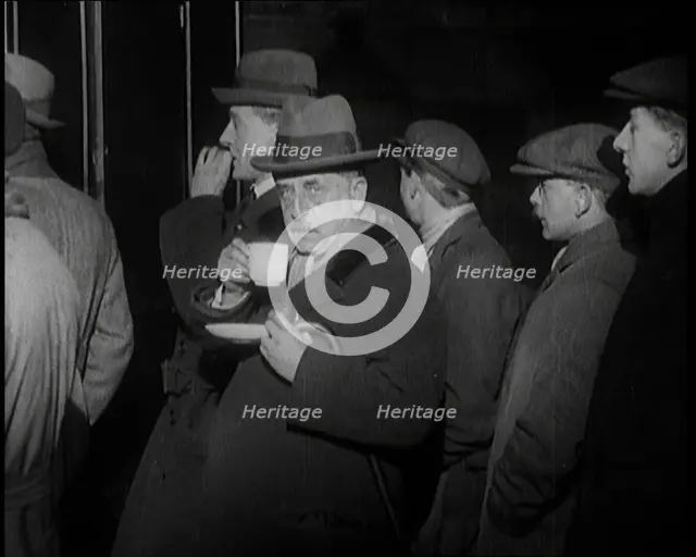 Author Sir James Barrie Drinking a Cup of Tea Surrounded By Male Civilians, 1924. Creator: British Pathe Ltd.
