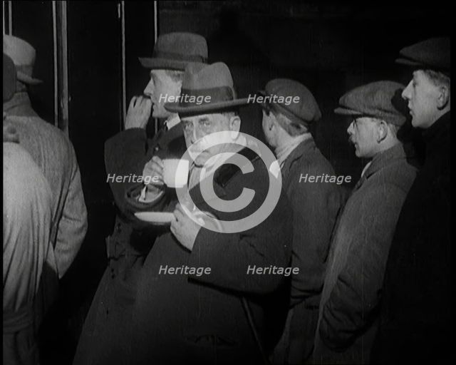 Author Sir James Barrie Drinking a Cup of Tea Surrounded By Male Civilians, 1924. Creator: British Pathe Ltd.