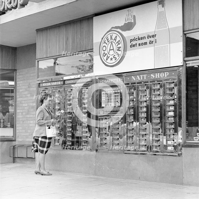 Automatic machine outside a self-service shop, Landskrona, Sweden, 1962. Creator: Unknown.