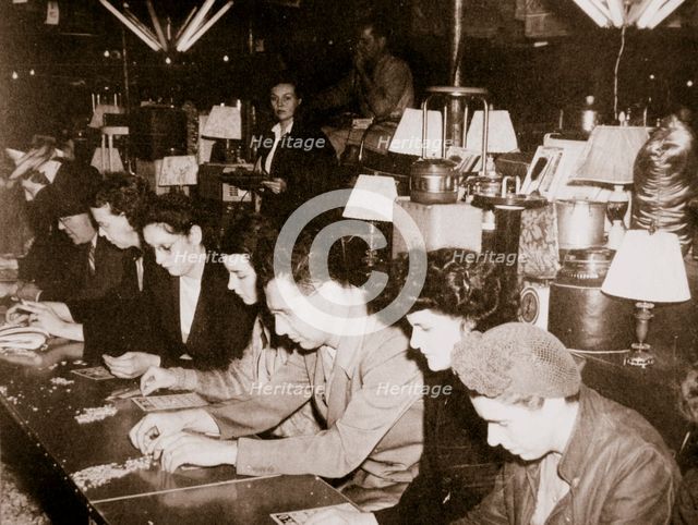 Automobile workers playing bingo at a carnival at Dearborn, Michigan, USA, c1938. Artist: Unknown