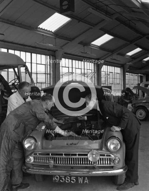 Automotive supplies representative with a 1960 Hillman Husky at a Sheffield Garage, 1963. Artist: Michael Walters