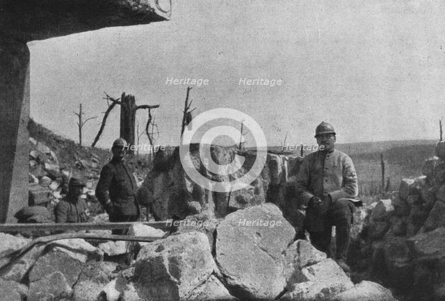 'Autour de Douaumont; au milieu des blocs de beton redoute eventree, un major et ses..., 1916. Creator: Unknown.