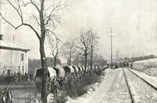 Autour de Verdun pendant la bataille; Sur la route, des camions automobiles amenant..., 1916 (1924) Creator: Unknown