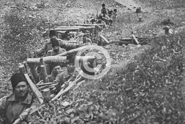'Aux armees Roumaines ; soldats roumains dans un boyau d'acces aux tranchees', 1916. Creator: Unknown.