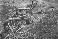Aux armees Roumaines ; soldats roumains dans un boyau d'acces aux tranchees 1916. Creator: Unknown