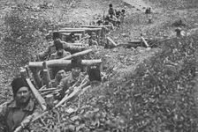 Aux armees Roumaines ; soldats roumains dans un boyau d'acces aux tranchees 1916. Creator: Unknown