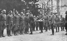 Aux armees Russes reorganisees; Au quartier imperial: le baiser de paques du Tsar..., 1916 (1924) Creator: Unknown