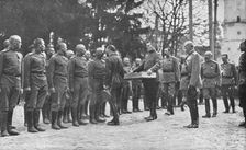 Aux armees Russes reorganisees; Au quartier imperial: le baiser de paques du Tsar..., 1916 (1924) Creator: Unknown